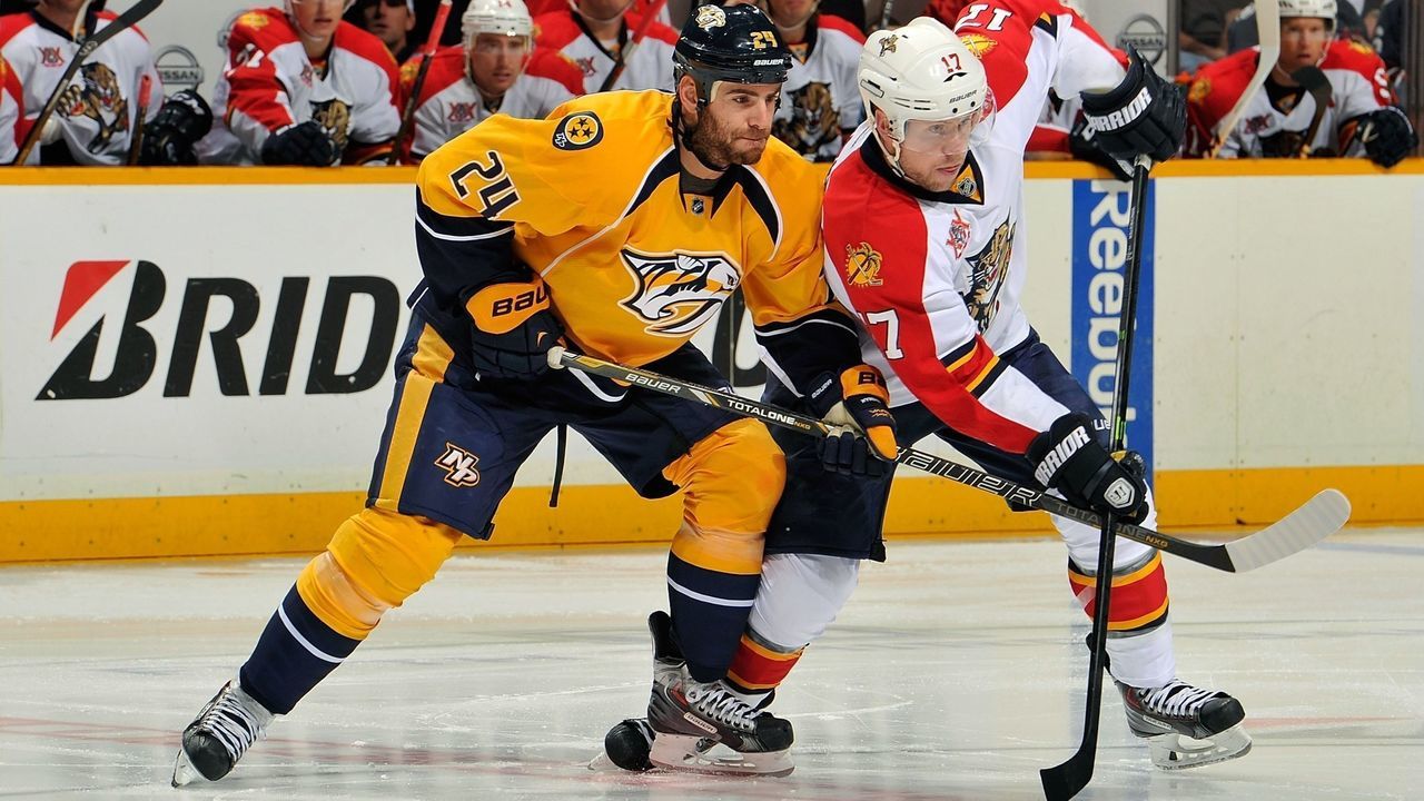 NASHVILLE, TN - OCTOBER 15: Eric Nystrom #24 of the Nashville Predators skates against Jesse Winchester #17 of the Florida Panthers at Bridgestone Arena on October 15, 2013 in Nashville, Tennessee.