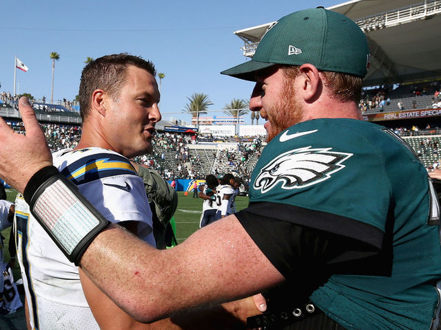 CARSON, CA - OCTOBER 01: Philip Rivers #17 of the Los Angeles Chargers talks with Carson Wentz #11 of the Philadelphia Eagles after a game at StubHub Center on October 1, 2017 in Carson, California. The Philadelphia Eagles defeated the Los Angeles Chargers 26-24.