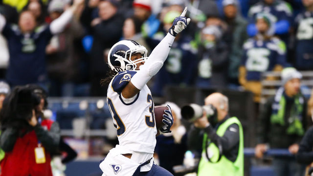 SEATTLE, WA - DECEMBER 17: Running back Todd Gurley #30 of the Los Angeles Rams holds a finger to the sky as he runs in a 57 yard touchdown against the Seattle Seahawks during the 2nd quarter of the game at CenturyLink Field on December 17, 2017 in Seattle, Washington.