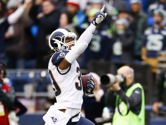 SEATTLE, WA - DECEMBER 17: Running back Todd Gurley #30 of the Los Angeles Rams holds a finger to the sky as he runs in a 57 yard touchdown against the Seattle Seahawks during the 2nd quarter of the game at CenturyLink Field on December 17, 2017 in Seattle, Washington.