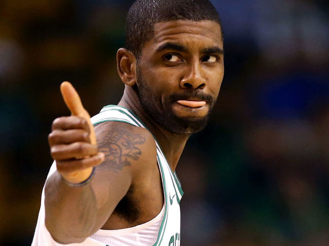BOSTON, MA - OCTOBER 2: Kyrie Irving #11 of the Boston Celtics gives a thumbs up during the first half against the Charlotte Hornets at TD Garden on October 2, 2017 in Boston, Massachusetts.