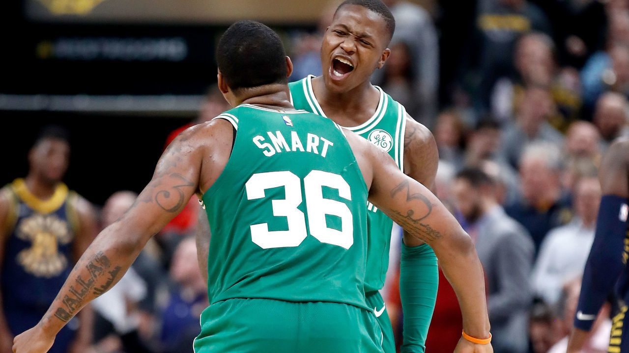 INDIANAPOLIS, IN - DECEMBER 18: Terry Rozier #12 of the Boston Celtics celebrates with Marcus Smart #36 after the 112-111 victory over the Indiana Pacers at Bankers Life Fieldhouse on December 18, 2017 in Indianapolis, Indiana.