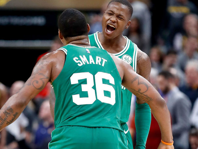 INDIANAPOLIS, IN - DECEMBER 18: Terry Rozier #12 of the Boston Celtics celebrates with Marcus Smart #36 after the 112-111 victory over the Indiana Pacers at Bankers Life Fieldhouse on December 18, 2017 in Indianapolis, Indiana.