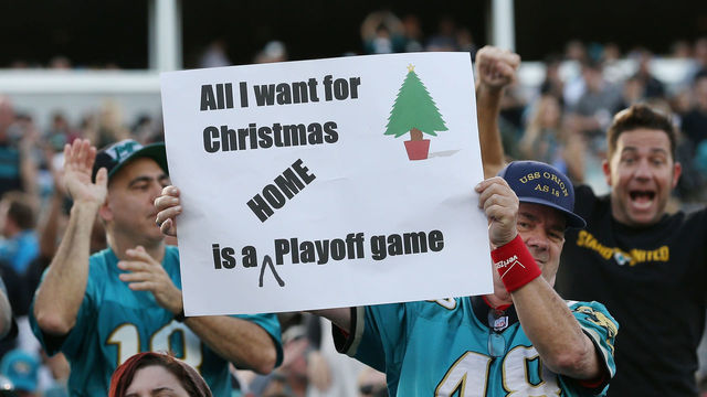 JACKSONVILLE, FL - DECEMBER 17: Jacksonville Jaguars fans pose in the stands after the Jaguars defeated the Houston Texans 45-7 at EverBank Field on December 17, 2017 in Jacksonville, Florida.