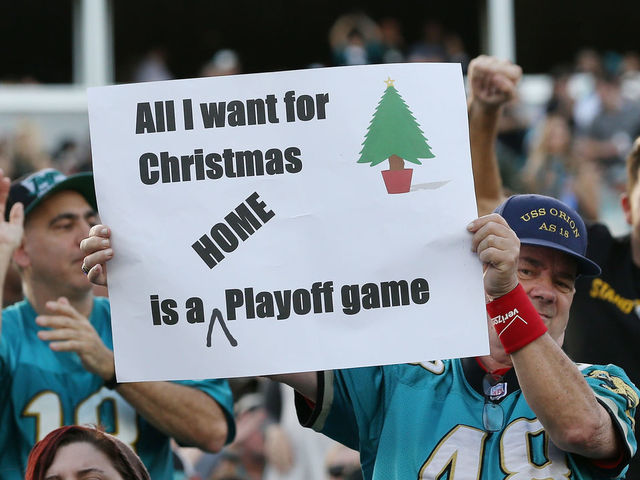 JACKSONVILLE, FL - DECEMBER 17: Jacksonville Jaguars fans pose in the stands after the Jaguars defeated the Houston Texans 45-7 at EverBank Field on December 17, 2017 in Jacksonville, Florida.