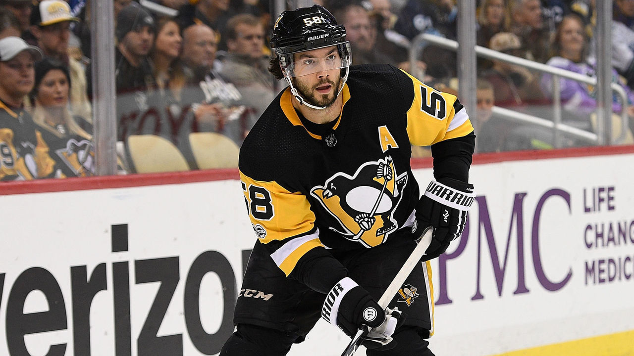 PITTSBURGH, PA - NOVEMBER 22: Kris Letang #58 of the Pittsburgh Penguins skates with the puck in the first period during the game against the Vancouver Canucks at PPG PAINTS Arena on November 22, 2017 in Pittsburgh, Pennsylvania.