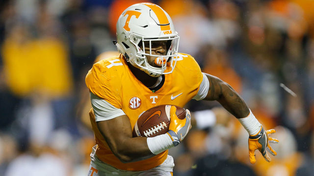 KNOXVILLE, TN - NOVEMBER 18: John Kelly #4 of the Tennessee Volunteers runs with the ball against the LSU Tigers during the first half at Neyland Stadium on November 18, 2017 in Knoxville, Tennessee.