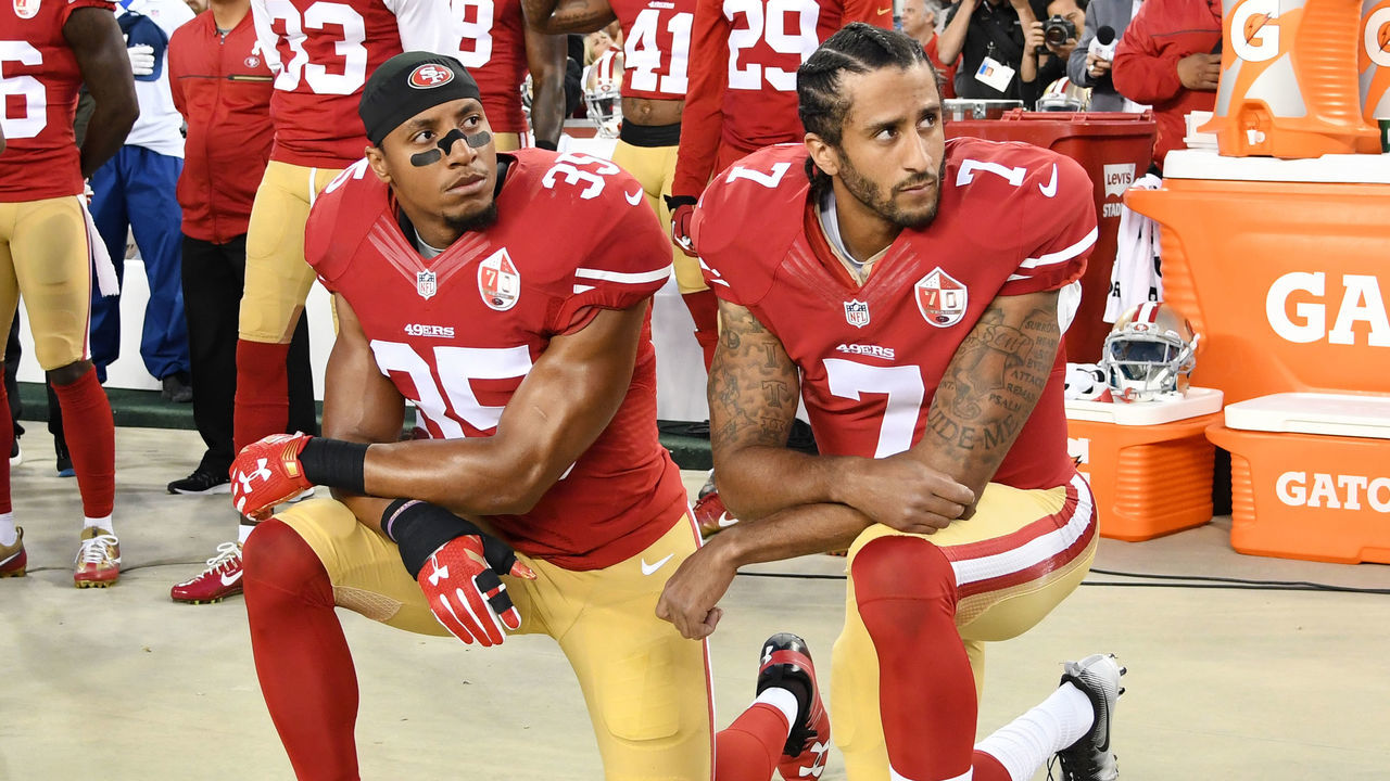 SANTA CLARA, CA - SEPTEMBER 12: Colin Kaepernick #7 and Eric Reid #35 of the San Francisco 49ers kneel in protest during the national anthem prior to playing the Los Angeles Rams in their NFL game at Levi's Stadium on September 12, 2016 in Santa Clara, California.