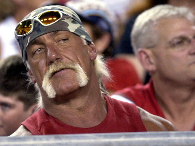 Hulk Hogan follows the play from a front-row seat during the second quarter August 23, 2003 at Raymond James Stadium, Tampa. The Tampa Bay Buccaneers defeated the Jacksonville Jaguars 10 - 6 in pre-season play.
