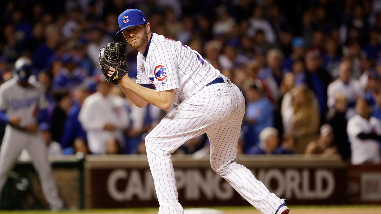 CHICAGO, IL - OCTOBER 18: Wade Davis #71 of the Chicago Cubs pitches in the ninth inning against the Los Angeles Dodgers during game four of the National League Championship Series at Wrigley Field on October 18, 2017 in Chicago, Illinois.