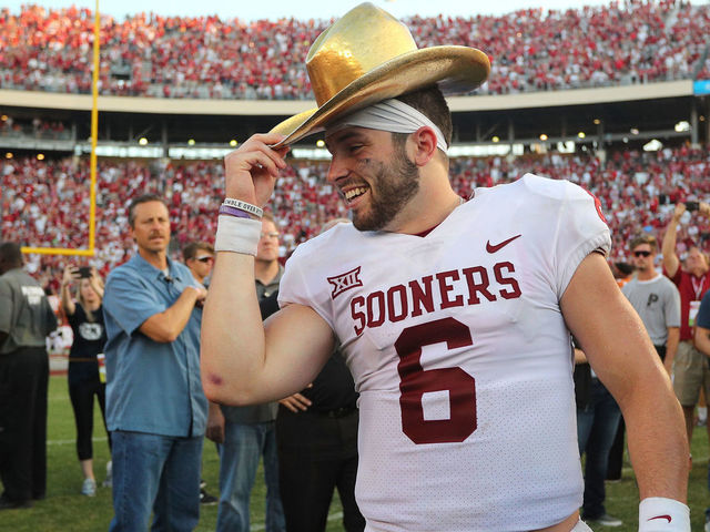 DALLAS, TX - OCTOBER 14: Baker Mayfield #6 of the Oklahoma Sooners wears the Golden Hat Trophy after the 29-24 win over the Texas Longhorns at Cotton Bowl on October 14, 2017 in Dallas, Texas.