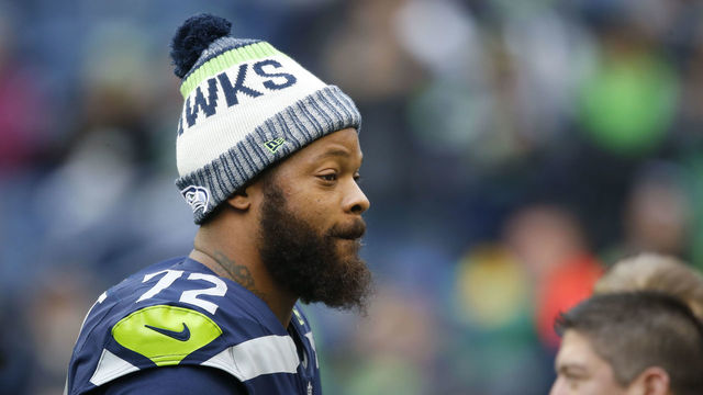SEATTLE, WA - DECEMBER 17: Defensive end Michael Bennett #72 of the Seattle Seahawks walks the field before the game against the Los Angeles Rams at CenturyLink Field on December 17, 2017 in Seattle, Washington.