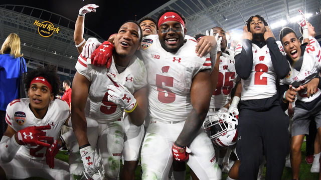 MIAMI GARDENS, FL - DECEMBER 30: Wisconsin Badgers players celebrate winning the 2017 Capital One Orange Bowl against the Miami Hurricanes at Hard Rock Stadium on December 30, 2017 in Miami Gardens, Florida.