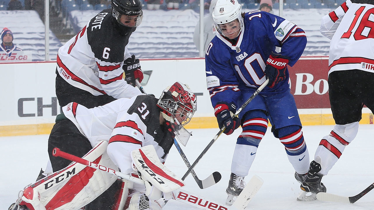 BUFFALO, NY - DECEMBER 29: Will Lockwood #10 of United States is stopped by Carter Hart #31 of Canada in the first period during the IIHF World Junior Championship at New Era Field on December 29, 2017 in Buffalo, New York.