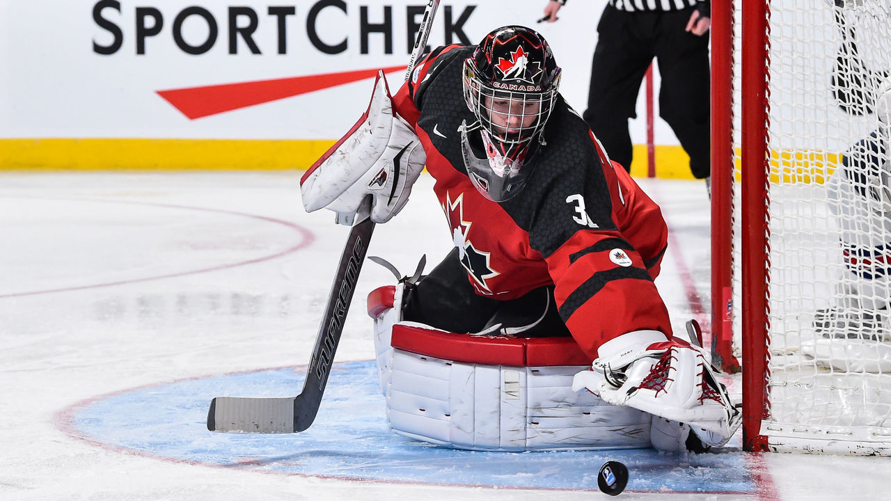 MONTREAL, QC - JANUARY 05: Carter Hart #31 of Team Canada looks to cover the puck during the 2017 IIHF World Junior Championship gold medal game against Team United States at the Bell Centre on January 5, 2017 in Montreal, Quebec, Canada. Team United States defeated Team Canada 5-4 in a shootout and win the gold medal round.