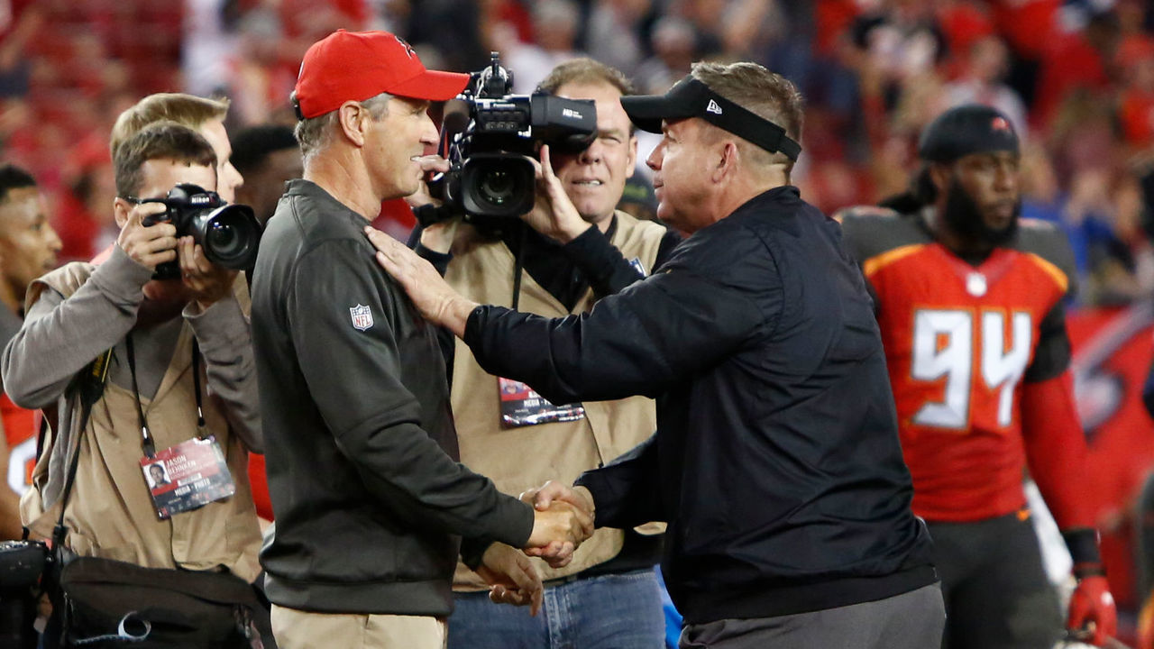 TAMPA, FL - DECEMBER 31: Head coach Dirk Koetter of the Tampa Bay Buccaneers meets up on the field with head coach Sean Payton of the New Orleans Saints following the Buccaneers' 31-24 win at an NFL football game on December 31, 2017 at Raymond James Stadium in Tampa, Florida.