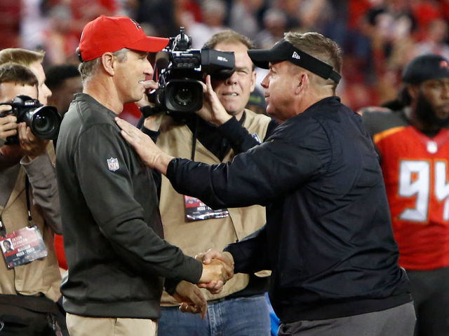 TAMPA, FL - DECEMBER 31: Head coach Dirk Koetter of the Tampa Bay Buccaneers meets up on the field with head coach Sean Payton of the New Orleans Saints following the Buccaneers' 31-24 win at an NFL football game on December 31, 2017 at Raymond James Stadium in Tampa, Florida.