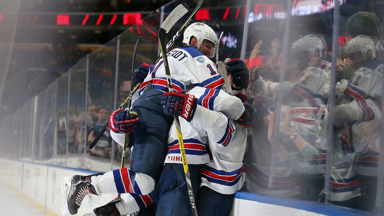 BUFFALO, NY - DECEMBER 31: Adam Fox #8 of United States celebrates with teammates after scoring the winning goal against Finland in the third period during the IIHF World Junior Championship at KeyBank Center on December 31, 2017 in Buffalo, New York.