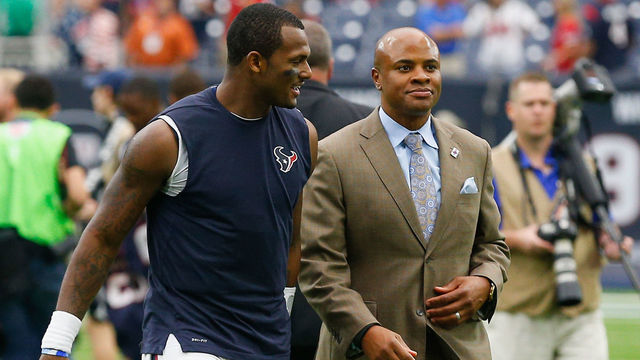 HOUSTON, TX - OCTOBER 01: Deshaun Watson #4 of the Houston Texans walks off the field with Houston Texans general manager Rick Smith after defeating the Tennessee Titans 57-14 at NRG Stadium on October 1, 2017 in Houston, Texas.