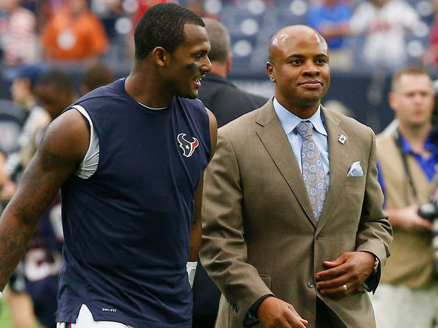 HOUSTON, TX - OCTOBER 01: Deshaun Watson #4 of the Houston Texans walks off the field with Houston Texans general manager Rick Smith after defeating the Tennessee Titans 57-14 at NRG Stadium on October 1, 2017 in Houston, Texas.