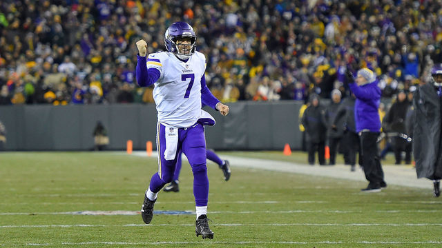 GREEN BAY, WI - DECEMBER 23: Case Keenum #7 of the Minnesota Vikings celebrates a touchdown against the Green Bay Packers during the first half at Lambeau Field on December 23, 2017 in Green Bay, Wisconsin.