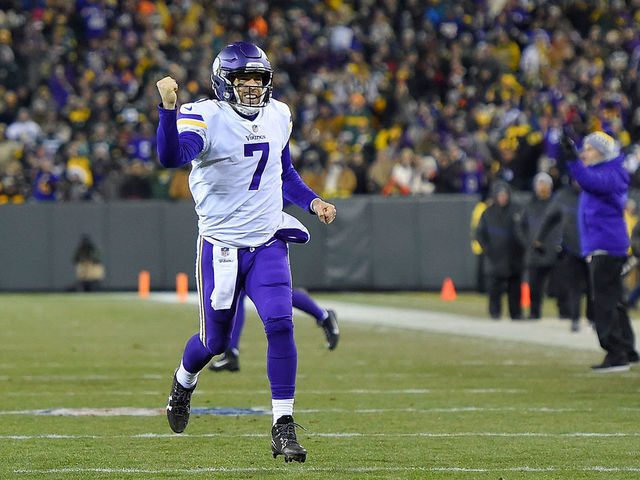 GREEN BAY, WI - DECEMBER 23: Case Keenum #7 of the Minnesota Vikings celebrates a touchdown against the Green Bay Packers during the first half at Lambeau Field on December 23, 2017 in Green Bay, Wisconsin.