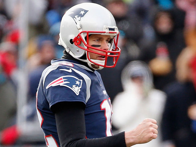 FOXBORO, MA - DECEMBER 31: Tom Brady #12 of the New England Patriots reacts after a rushing touchdown by Dion Lewis #33 (not pictured) during the first quarter against the New York Jets at Gillette Stadium on December 31, 2017 in Foxboro, Massachusetts.