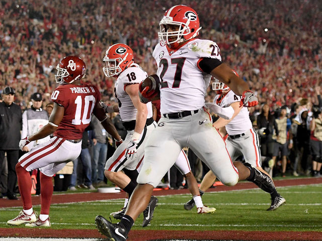 PASADENA, CA - JANUARY 01: Running back Nick Chubb #27 of the Georgia Bulldogs scores on a two-yard touchdown run late in the fourth quarter against the Oklahoma Sooners in the 2018 College Football Playoff Semifinal at the Rose Bowl Game presented by Northwestern Mutual at the Rose Bowl on January 1, 2018 in Pasadena, California.