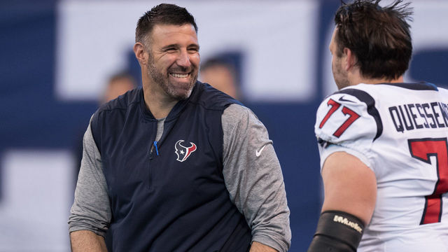 INDIANAPOLIS, IN - DECEMBER 31: Houston Texans defensive coordinator Mike Vrabel talks to Houston Texans tackle David Quessenberry (77) before the NFL game between the Indianapolis Colts and Houston Texans on December 31, 2017, at Lucas Oil Stadium in Indianapolis, IN.