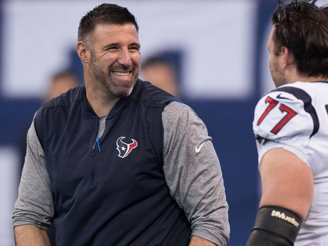 INDIANAPOLIS, IN - DECEMBER 31: Houston Texans defensive coordinator Mike Vrabel talks to Houston Texans tackle David Quessenberry (77) before the NFL game between the Indianapolis Colts and Houston Texans on December 31, 2017, at Lucas Oil Stadium in Indianapolis, IN.