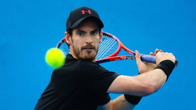 TOPSHOT - Britain's Andy Murray hits a return during training for his first round men's singles match at the Brisbane International tennis tournament at the Pat Rafter Arena in Brisbane on December 31, 2017. / AFP PHOTO / Patrick HAMILTON / -- IMAGE RESTRICTED TO EDITORIAL USE - STRICTLY NO COMMERCIAL USE --