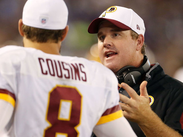 BALTIMORE, MD - AUGUST 29: Head coach Jay Gruden of the Washington Redskins talks with quarterback Kirk Cousins #8 of the Washington Redskins in the fourth quarter of a preseason game against the Baltimore Ravens at M&T Bank Stadium on August 29, 2015 in Baltimore, Maryland.