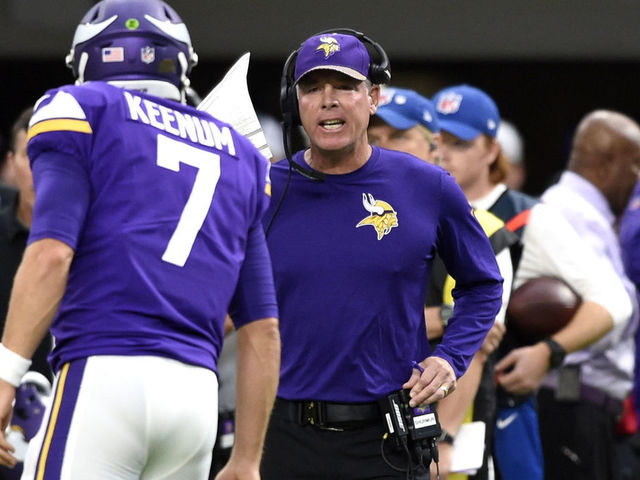 MINNEAPOLIS, MN - OCTOBER 1: Case Keenum #7 of the Minnesota Vikings speaks with offensive coordinator Pat Shurmur in the second quarter of the game against the Detroit Lions on October 1, 2017 at U.S. Bank Stadium in Minneapolis, Minnesota.