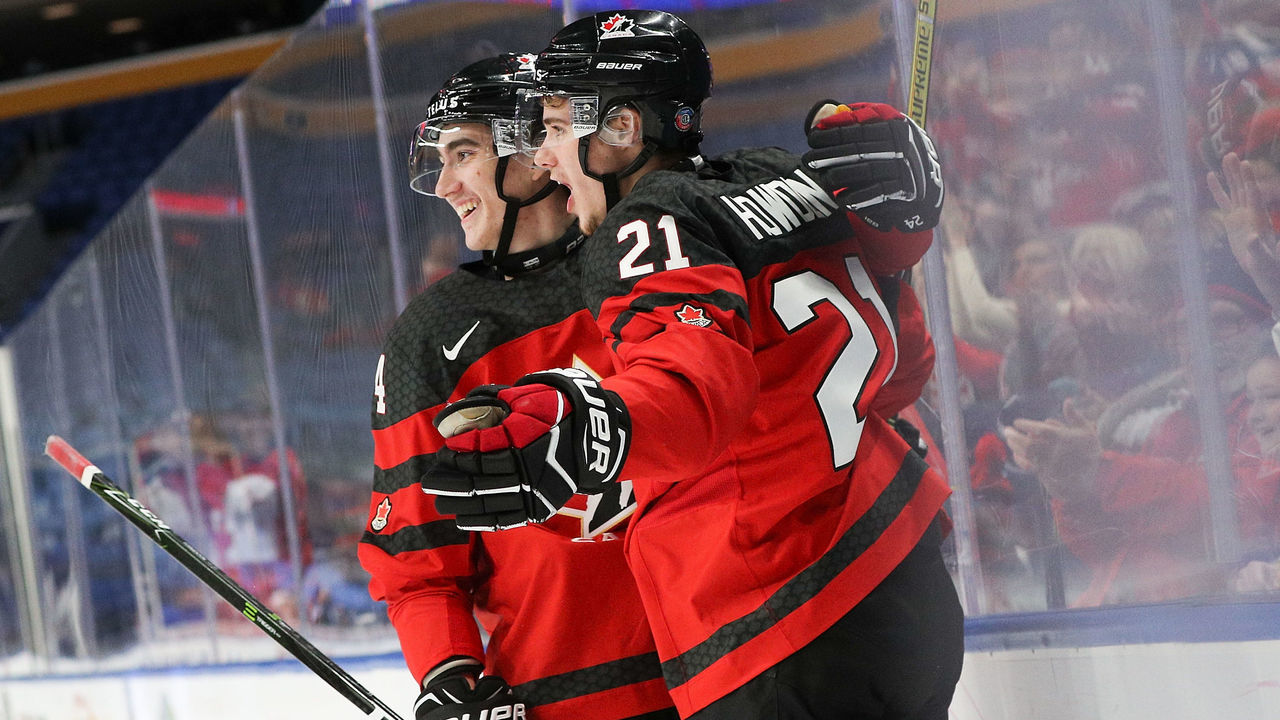 BUFFALO, NY - JANUARY 02: Brett Howden #21 of Canada celebrates his goal with Alex Formenton #24 of Canada during the first period of play in the Quarterfinal IIHF World Junior Championship game at the KeyBank Center on January 2, 2018 in Buffalo, New York.