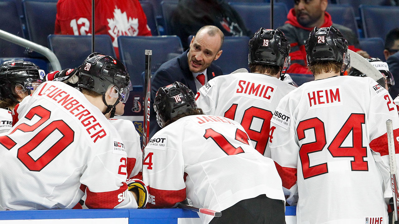 BUFFALO, NY - JANUARY 02: Christian Wohlwend head coach of Switzerland gives instructions during a timeout against Canada in the second period of play in the Quarterfinal IIHF World Junior Championship game at the KeyBank Center on January 2, 2018 in Buffalo, New York.