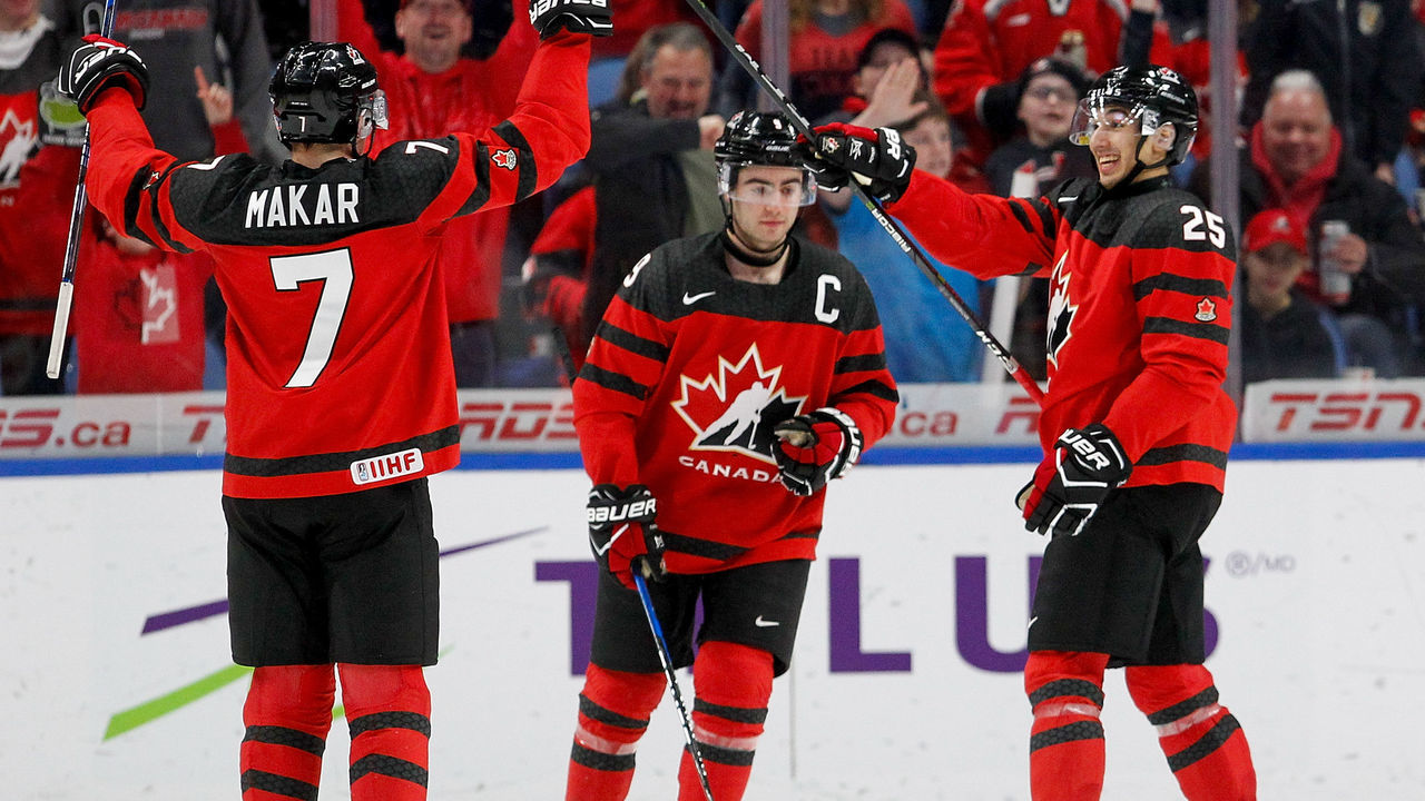 BUFFALO, NY - JANUARY 02: Cale Makar #7, Dillon Dubé #9 and Jordan Kyrou #25 of Canada celebrate Canada's 5th goal of the game during the second period of play in the Quarterfinal IIHF World Junior Championship game at the KeyBank Center on January 2, 2018 in Buffalo, New York.
