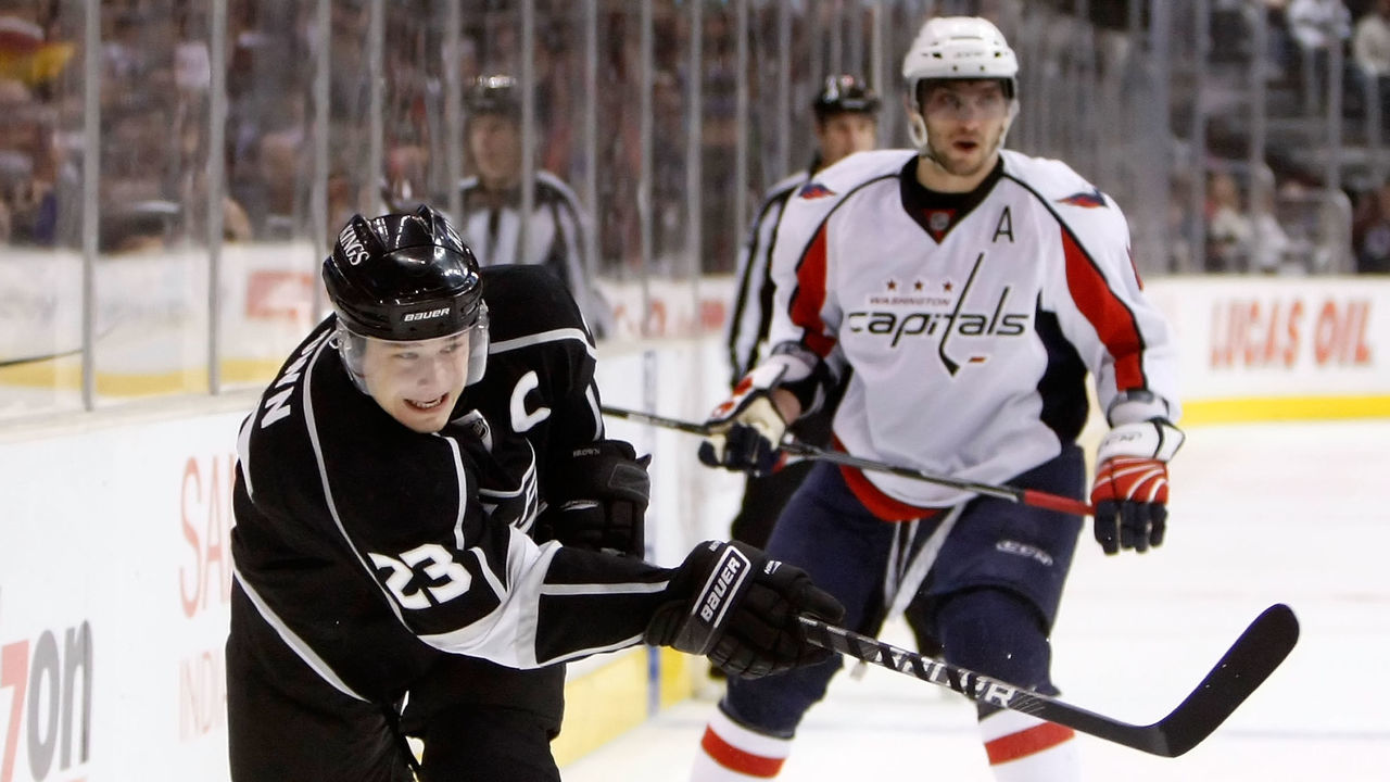 LOS ANGELES, CA - JANUARY 02: Dustin Brown #23 of the Los Angeles Kings shoots the puck in front of Alex Ovechkin #8 of the Washington Capitals in the second period at Staples Center on January 2, 2010 in Los Angeles, California.