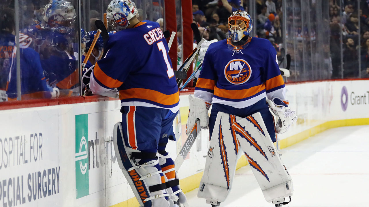 NEW YORK, NY - DECEMBER 13: Thomas Greiss #1 of the New York Islanders replaces Jaroslav Halak #41 in the nets during the second period against the Dallas Stars at the Barclays Center on December 13, 2017 in the Brooklyn borough of New York City.