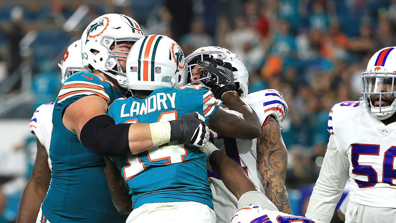 MIAMI GARDENS, FL - DECEMBER 31: Jarvis Landry #14 of the Miami Dolphins getting into an argument with Jordan Poyer #21 of the Buffalo Bills in the fourth quarter at Hard Rock Stadium on December 31, 2017 in Miami Gardens, Florida.