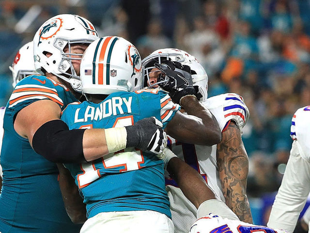MIAMI GARDENS, FL - DECEMBER 31: Jarvis Landry #14 of the Miami Dolphins getting into an argument with Jordan Poyer #21 of the Buffalo Bills in the fourth quarter at Hard Rock Stadium on December 31, 2017 in Miami Gardens, Florida.