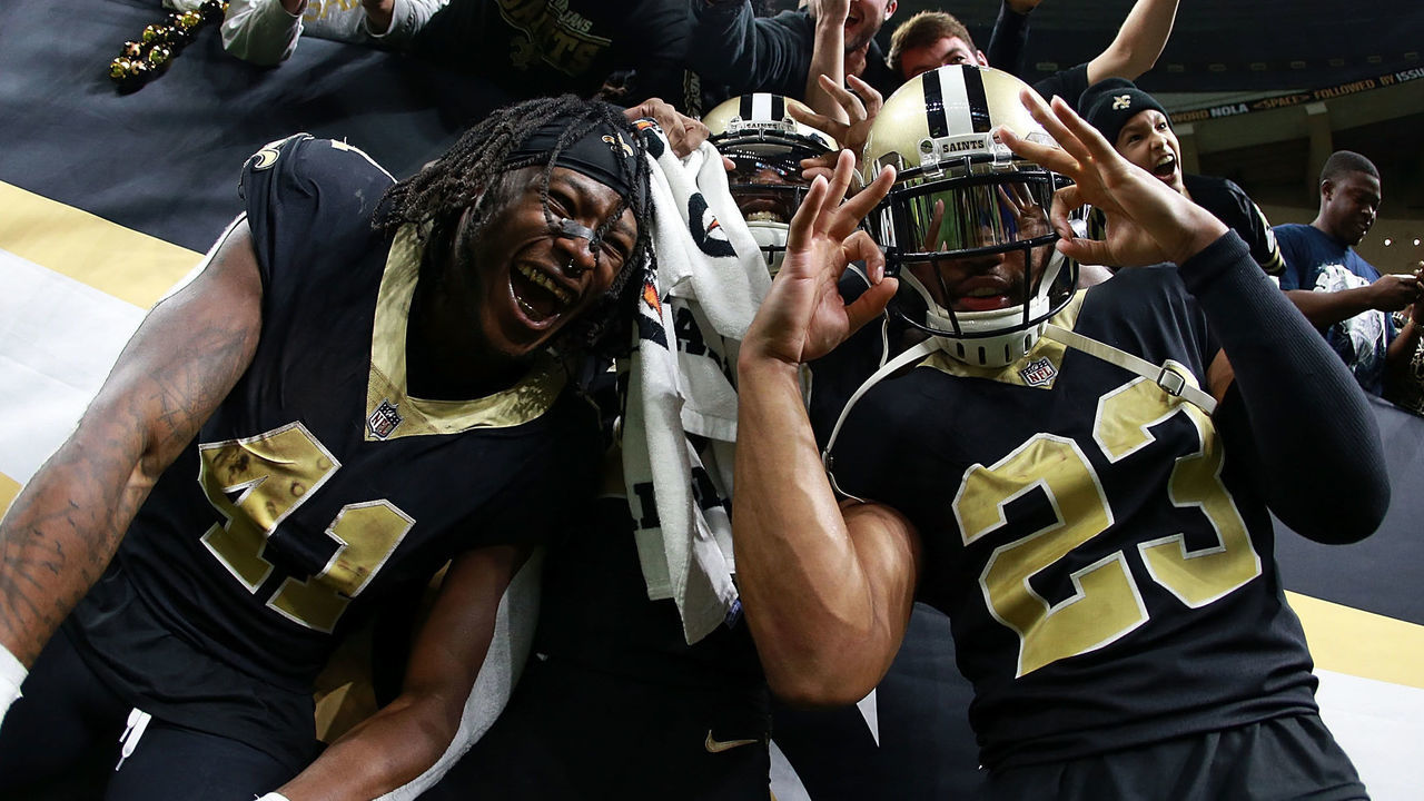NEW ORLEANS, LA - DECEMBER 24: Alvin Kamara #41 of the New Orleans Saints, Marshon Lattimore #23 and Michael Thomas #13 celebrate after a game against the Atlanta Falcons at the Mercedes-Benz Superdome on December 24, 2017 in New Orleans, Louisiana.