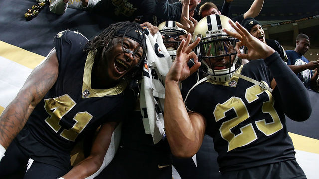 NEW ORLEANS, LA - DECEMBER 24: Alvin Kamara #41 of the New Orleans Saints, Marshon Lattimore #23 and Michael Thomas #13 celebrate after a game against the Atlanta Falcons at the Mercedes-Benz Superdome on December 24, 2017 in New Orleans, Louisiana.