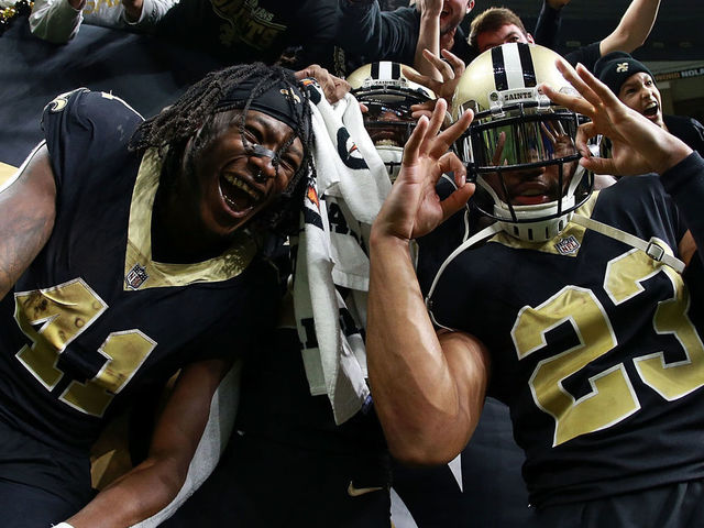 NEW ORLEANS, LA - DECEMBER 24: Alvin Kamara #41 of the New Orleans Saints, Marshon Lattimore #23 and Michael Thomas #13 celebrate after a game against the Atlanta Falcons at the Mercedes-Benz Superdome on December 24, 2017 in New Orleans, Louisiana.