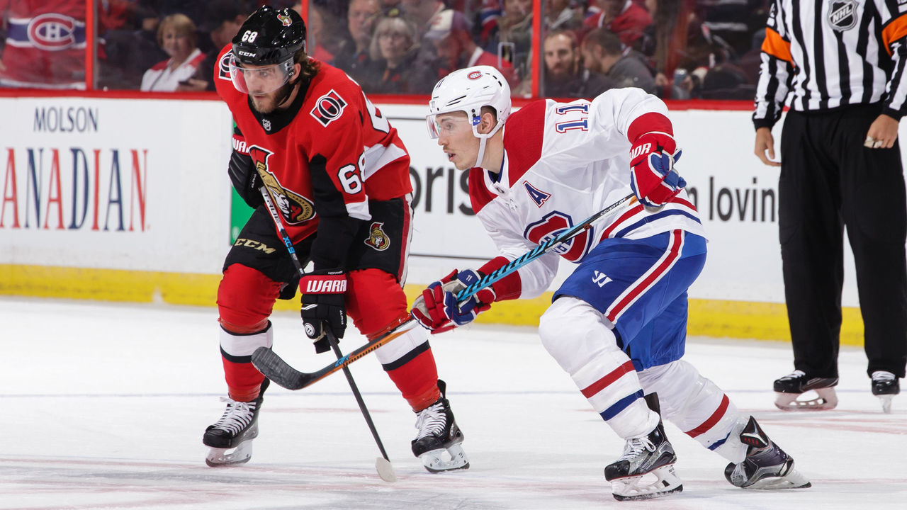 OTTAWA, ON - OCTOBER 30: Mike Hoffman #68 of the Ottawa Senators takes a face-off against Brendan Gallagher #11 of the Montreal Canadiens at Canadian Tire Centre on October 30, 2017 in Ottawa, Ontario, Canada.