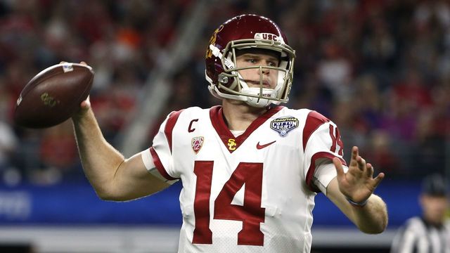 ARLINGTON, TX - DECEMBER 29: Sam Darnold #14 of the USC Trojans looks to throw against the Ohio State Buckeyes in the first half of the 82nd Goodyear Cotton Bowl Classic between USC and Ohio State at AT&T Stadium on December 29, 2017 in Arlington, Texas.