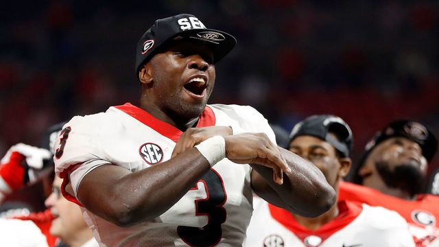 ATLANTA, GA - DECEMBER 02: Roquan Smith #3 of the Georgia Bulldogs reacts to winning the game MVP trophy after beating the Auburn Tigers in the SEC Championship at Mercedes-Benz Stadium on December 2, 2017 in Atlanta, Georgia.