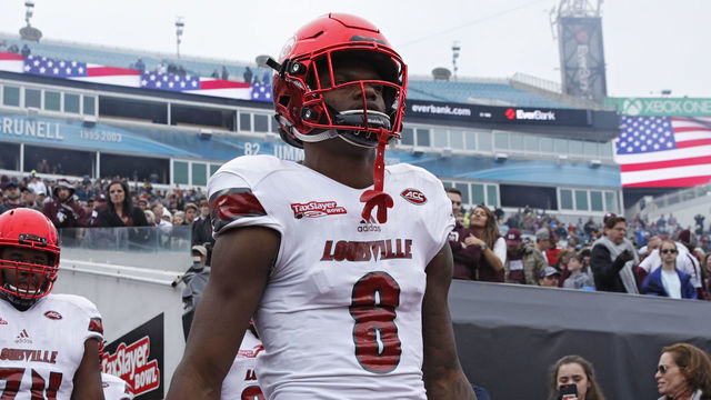 JACKSONVILLE, FL - DECEMBER 30: Lamar Jackson #8 of the Louisville Cardinals takes the field prior to the TaxSlayer Bowl against the Mississippi State Bulldogs at EverBank Field on December 30, 2017 in Jacksonville, Florida.