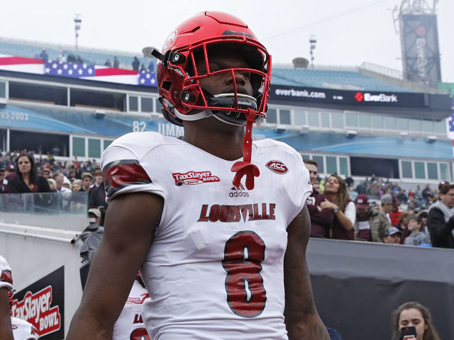 JACKSONVILLE, FL - DECEMBER 30: Lamar Jackson #8 of the Louisville Cardinals takes the field prior to the TaxSlayer Bowl against the Mississippi State Bulldogs at EverBank Field on December 30, 2017 in Jacksonville, Florida.