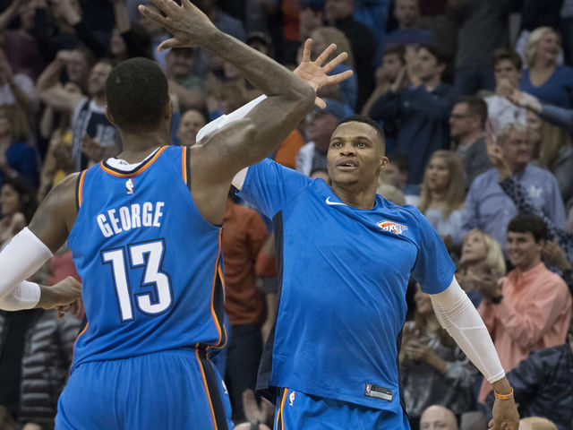 OKLAHOMA CITY, OK - NOVEMBER 22: Paul George #13 of the Oklahoma City Thunder and Russell Westbrook #0 of the Oklahoma City Thunder celebrate during the second half of a NBA game against the Golden State Warriors at the Chesapeake Energy Arena on November 22, 2017 in Oklahoma City, Oklahoma.