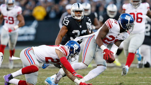 OAKLAND, CA - DECEMBER 03: Landon Collins #21 of the New York Giants recovers a fumble by Johnny Holton #16 of the Oakland Raiders during their NFL game at Oakland-Alameda County Coliseum on December 3, 2017 in Oakland, California.